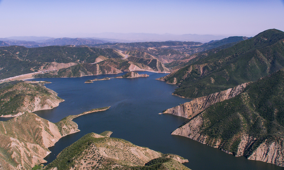 An aerial view of Pyramid Lake and Dam on May 12, 2023. Pyramid Lake, a reservoir located in Los Angeles County, is formed by Pyramid Dam on Piru Creek, near Castaic, California. On this date, the storage was 164,018 reservoir acre-feet (AF), which is 91 percent of the total capacity.
