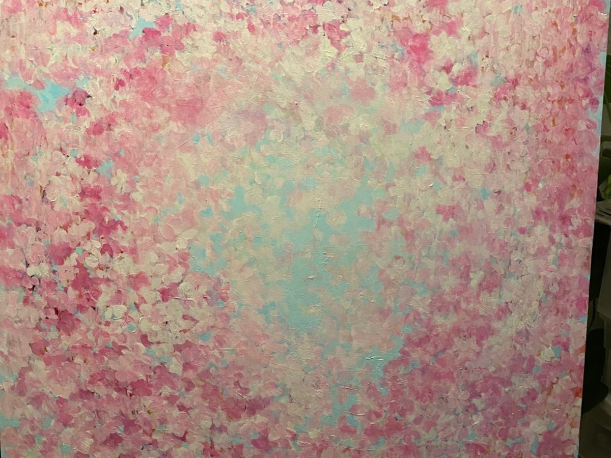 The painting depicts the feeling of being under hundreds of pink and white falling cherry blossoms at a tree located in the Crystal Hermitage Gardens at Ananda Village.